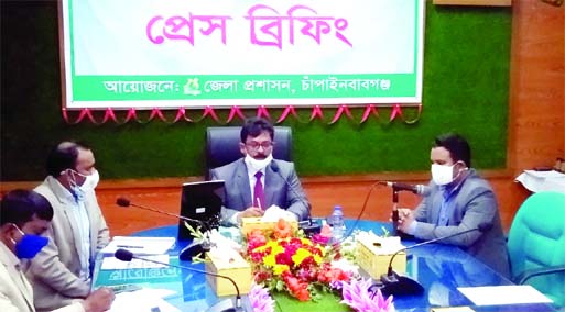 Chapainawabganj DC Md. Manjurul Hafij speaks at a press briefing over the distribution of the houses to landless families at the DC conference room on Thursday.