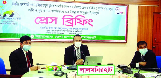 Lalmonirhat DC Md. Abu Zafar briefs media over the distribution of houses to homeless families in five upazilas of the district in the DC conference room on Thursday.