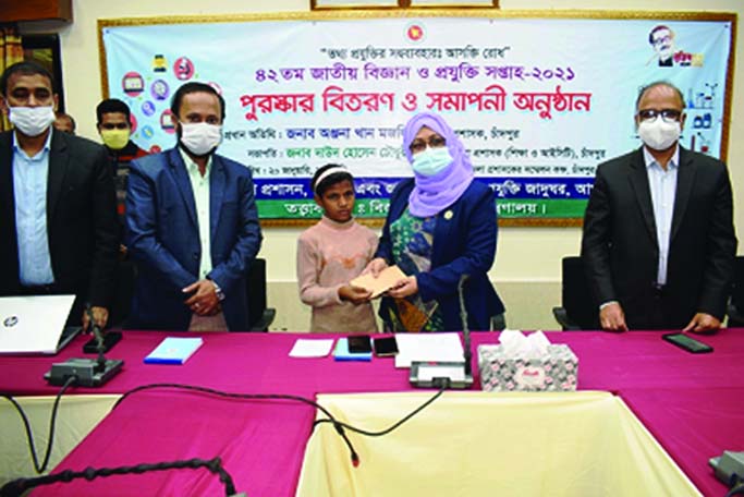 Chandpur DC Anjana Khan Majlish handing over cash money to struggling little girl Kulsum for the help of her sick parents at a simple ceremony on Wednesday.