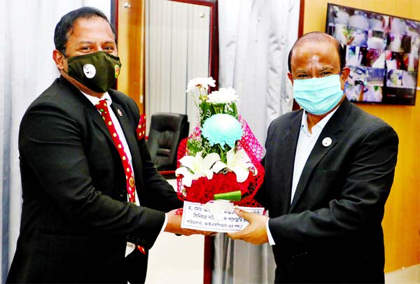 Director of ISPR Lt. Col. Abdullah Ibne Jayed greets Secretary of Defence Ministry Dr. Abu Hena Mostofa Kamal as the latter has been promoted to NDC Senior Secretary.