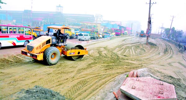 The construction work of Dhaka-Sylhet 4-lane Highway goes on in full swing at Katherpool area of Jatrabari in the capital on Friday.