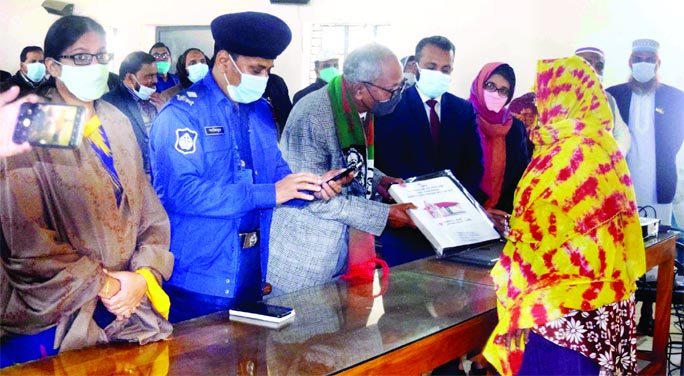 Moslem Uddin, MP, handover document of house to a landless woman as a gift from Prime Minister Sheikh Hasina at a ceremony in Fulbaria Upazila of Mymensingh district on Saturday.Moslem Uddin, MP, handover document of house to a landless woman as a gift fr