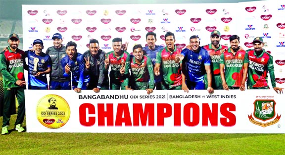 Members of Bangladesh Cricket team, the champions in the Bangabandhu Bangladesh-West Indies ODI series, pose for a photo session after winning the third ODI against West Indies at the Zahur Ahmed Chowdhury Stadium in Chattogram on Monday.