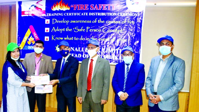 Md Afzal Karim, DMD of Sonali Bank Limited, handing over the certificates as a chief guest for successfully completion of a workshop on Fire Safety at the bank's head office in the city recently. Md Zahidul Haque, Md Abdul Mannan, Murshedul Kabir, DMDs o