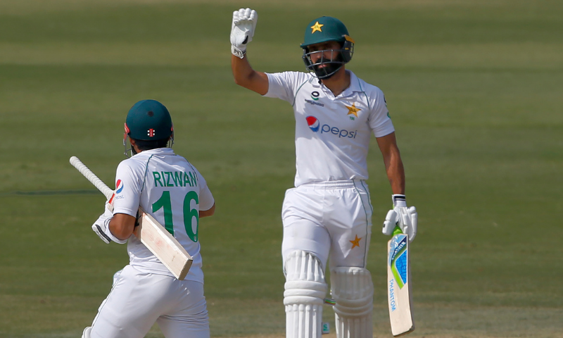 Fawad Alam (right) celebrates after his fifty during the second day of the first Test match between Pakistan and South Africa at the National Stadium in Karachi on Wednesday.
