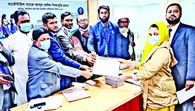 Moudud Ahmed, Manager, Mercantile Bank Kalaiya Branch distributes pay-order and certificate of Mercantile Bank Abdul Jalil Education Scholarship 2019 among meritorious students in Baufal Upazila of Patuakhali district in the Mercantile Bank Kalaiya branch