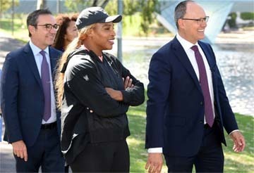 Serena Williams (centre) walks after completing her two weeks' quarantine in Adelaide on Friday.