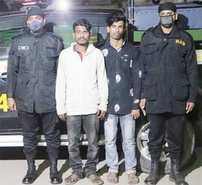 RAB-4 detains two drug traders with 239 bottles of phensidyl conducting raid at Aminbazar area under Savar Model Thana on Friday.