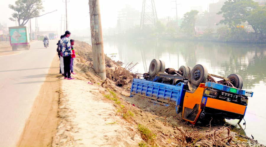 A truck veers off to a road side ditch being driven recklessly at Demra Highway in the city on Monday.