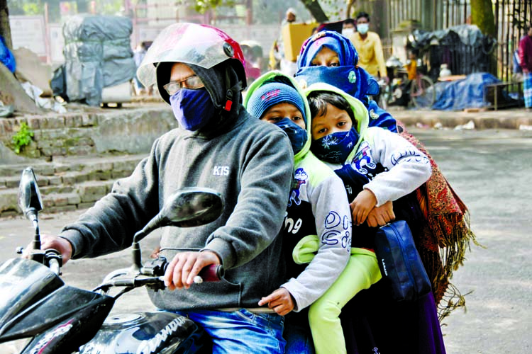 A family of four takes a risky ride on a motorbike although fatalities from motorbike accidents continue to rise in the capital. This photo was taken on the road in front of High Court's Mazar Gate on Tuesday.