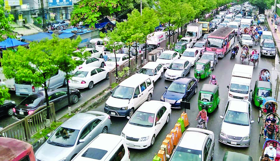 Vehicles get stuck in a traffic jam in the capital's New Market area in Dhaka city on Tuesday. People in the capital experienced severe traffic congestion on different roads yesterday.