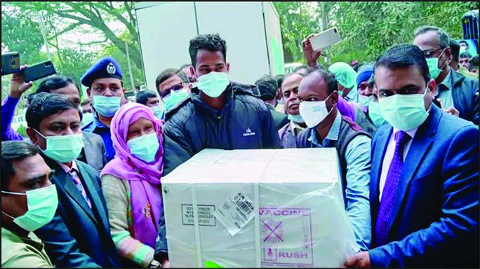 Sylhet Civil Surgeon Dr. Pramannada Mondal receives 2,28,000 doses of coronavirus vaccines from a representative of Beximco Pharmaceuticals Limited on the premises of district's Expanded Program of Immunization (EPI) building on Sunday.