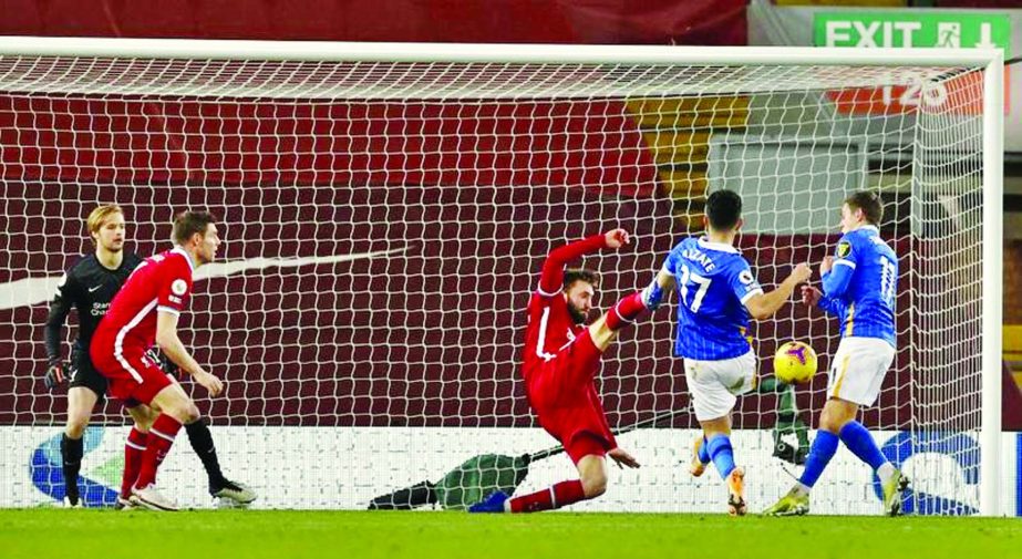 Brighton's midfielder Steven Alzate (second right) scores the opening goal during the English Premier League football match against Liverpool at Anfield in Liverpool, north west England on Wednesday.