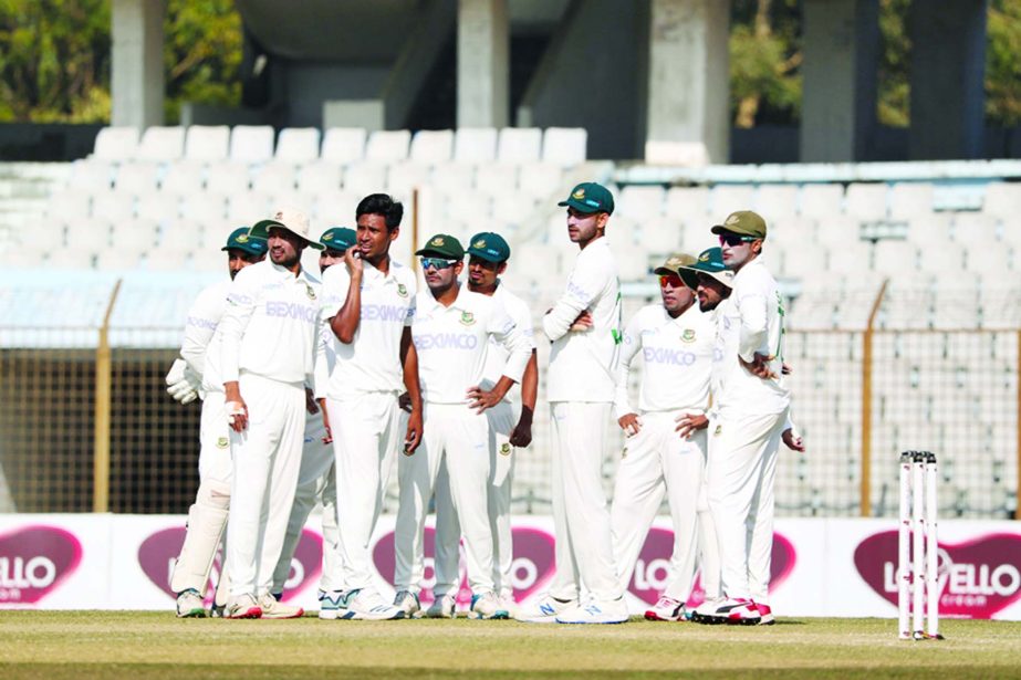 Players of the Bangladesh Cricket team waiting for DRS (Decision Review System) of John Campbell of West Indies on the second day of the first Test at the Zahur Ahmed Chowdhury Stadium in Chattogram on Thursday. John Campbell was trapped leg before wicket