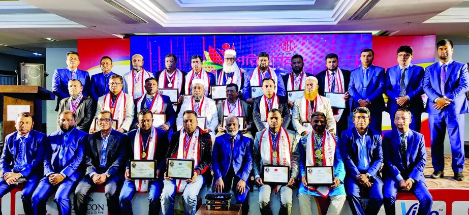 RN Paul, Managing Director of RFL Group, poses for photo session with the participants of Dealers' Conference of RFL Plastics held at The Palace Luxury Resort in Habiganj on Monday. Top 64 dealers were awarded in the conference. High officials of the com