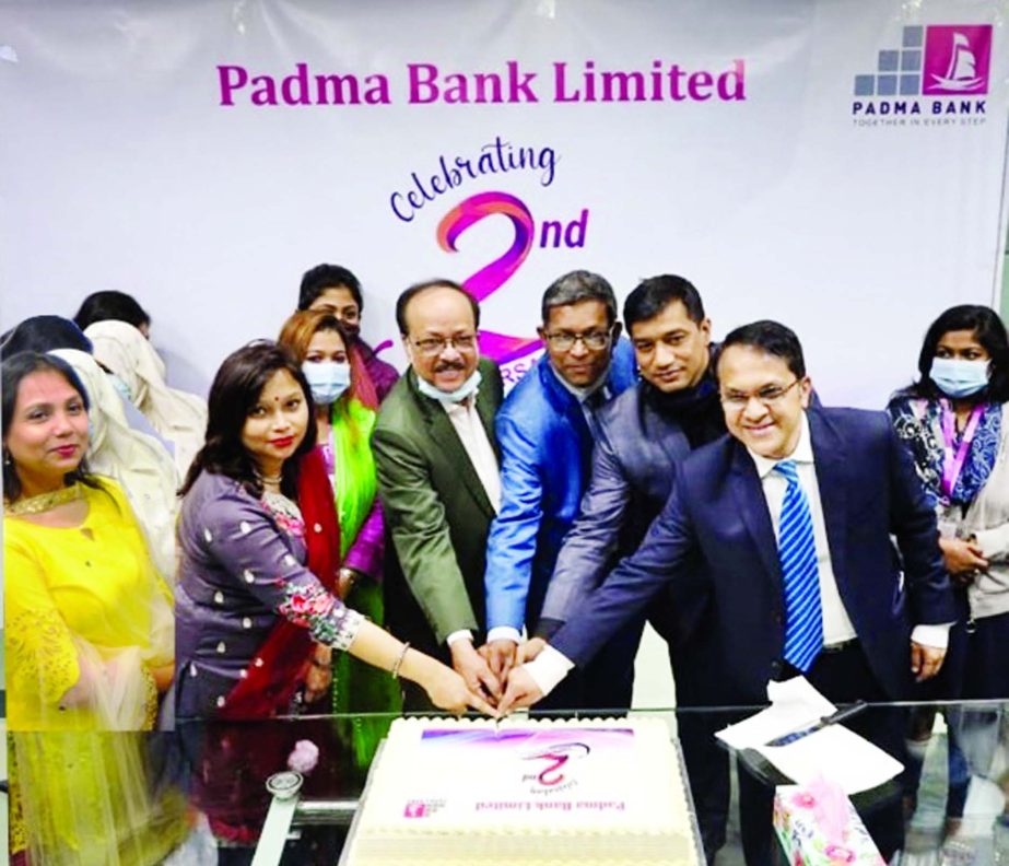 Md. Ehsan Khasru, Managing Director & CEO of Padma Bank Limited, celebrating the bankâ€™s 2nd founding anniversary by cutting cake at its head office in the city on Wednesday. Faisal Ahsan Chowdhury, DMD, Zabed Amin, SEVP and Head of Business, M Ahs