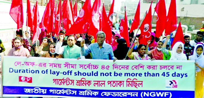 Jatiya Garments Sramik Federation brings out a red flag procession in the city's Topkhana Road on Friday demanding that the duration of lay-off should not be more than 45 days.