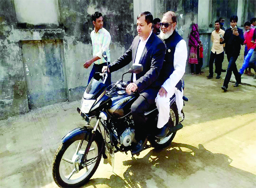 Liberation War Affairs Minister AKM Mozammel Haque and Gazipur City Corporation Mayor Jahangir Alam visit various development works in the city on Saturday morning by riding a motorbike.