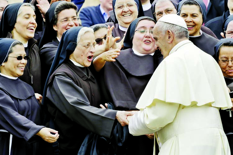 Pope Francis greets a nun during the weekly general audience at the Vatican, January 15, 2020.