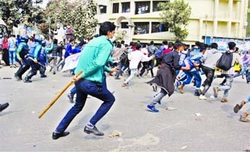 Police chasing polytechnic students to clear the Shahbagh intersection in the capital on Sunday.