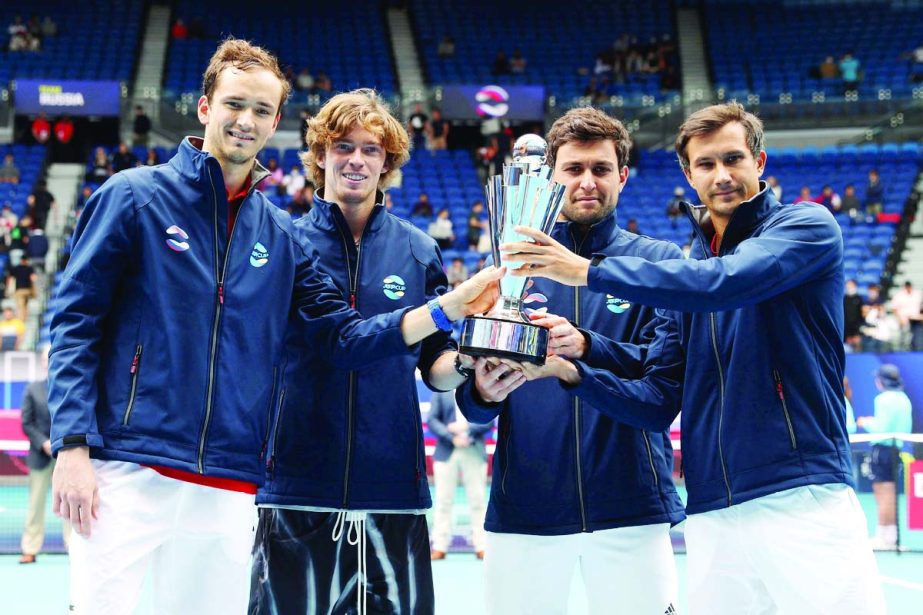 (From left to right) Russia's Daniil Medvedev, Andrey Rublev, Aslan Karatsev and Evgeny Donskoy celebrate with the trophy after winning the ATP Cup final against Italy on Sunday.