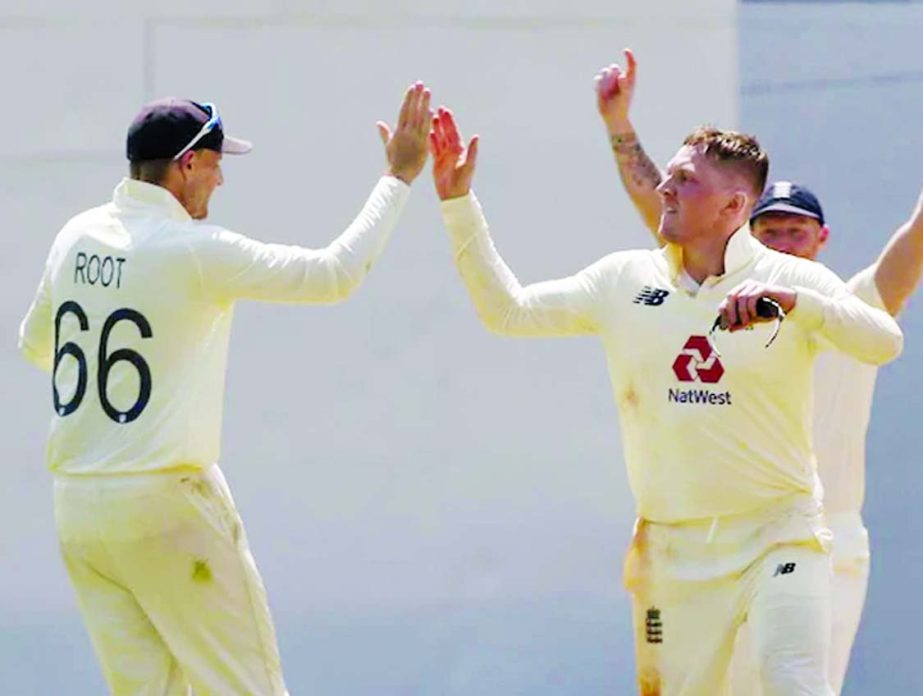 Dom Bess (right) celebrates after taking a wicket on Day 3 of the first Test match against India in Chennai on Sunday.