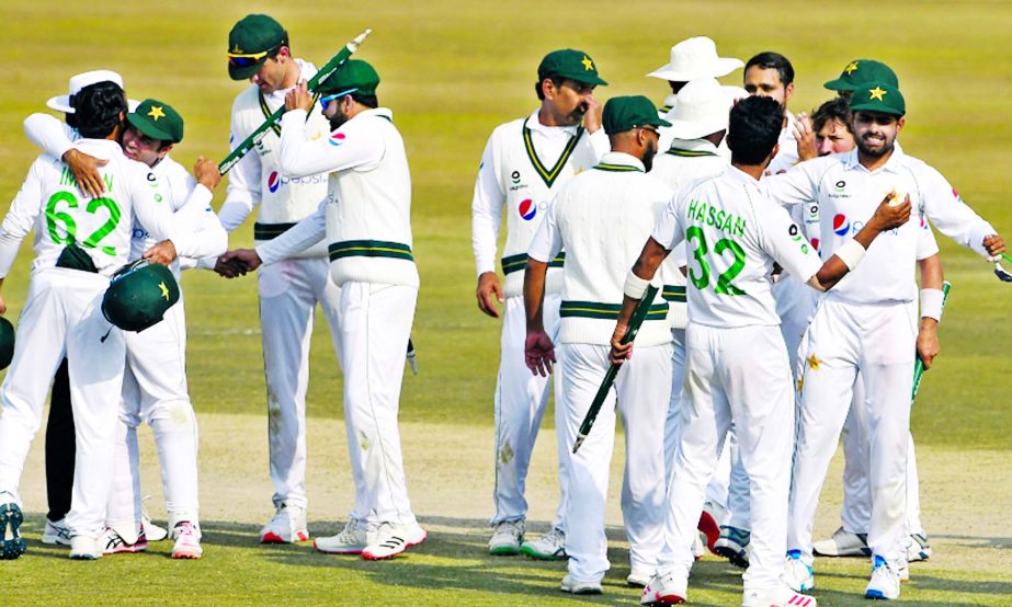 Pakistan's players celebrate after winning the Test series against South Africa during the fifth and final day of the second Test cricket match against South Africa at the Rawalpindi Cricket Stadium in Rawalpindi on Monday.