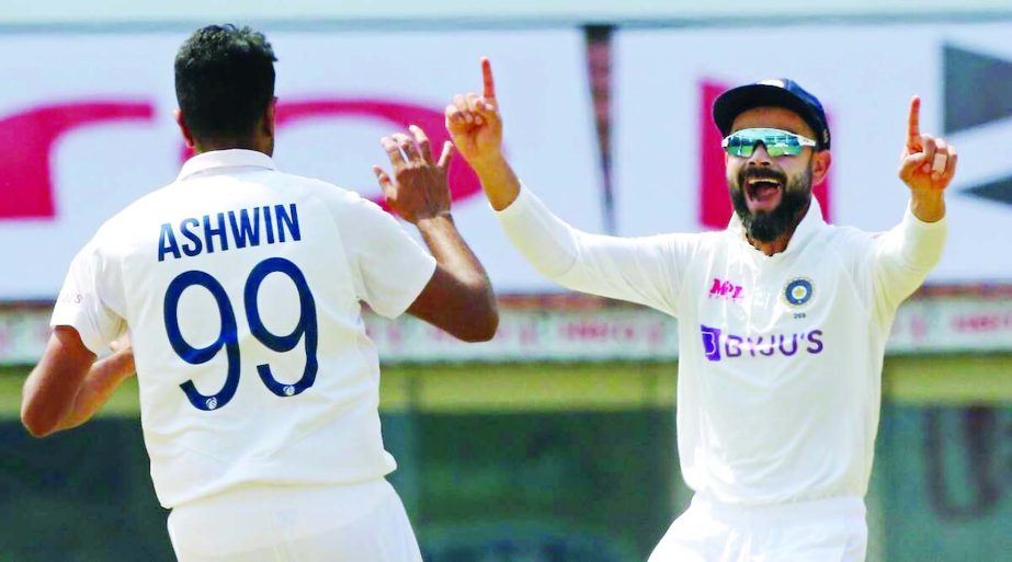 Ravichandran Ashwin (left) celebrating a wicket with India captain Virat Kohli against England on the fourth day of the first Test at the MA Chidambaram Stadium in Chennai on Monday.