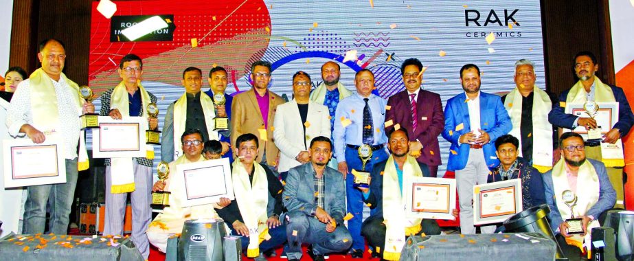 SAK Ekramuzzaman, Managing Director of RAK Ceramics Limited, poses for a photo with the participants of its Annual Dealer Meet at BRAC CDM in Gazipur on Tuesday. Sadhan Kumar Dey, Chief Operating Officer, and other senior officials of the company were pre