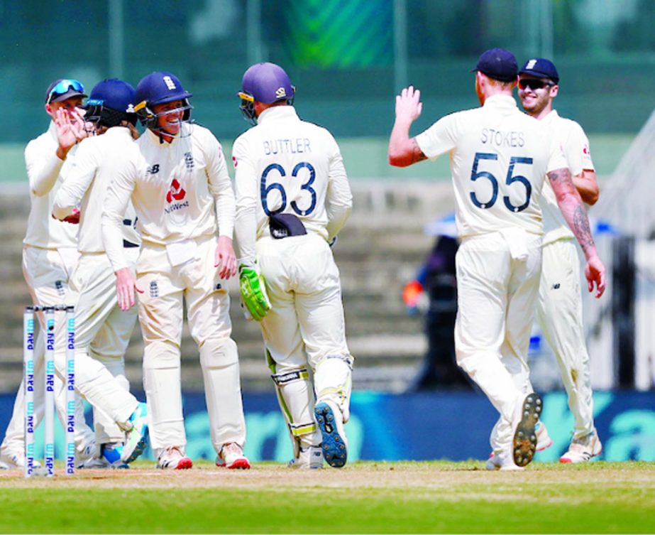 England team celebrate on Day 5 of the first Test against India in Chennai, India on Tuesday.