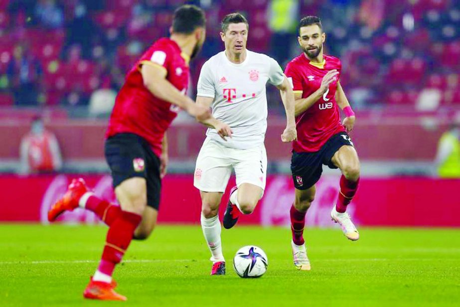 Bayern's Robert Lewandowski (center) runs with the ball during the FIFA Club World Cup semifinal soccer match against Al Ahly at Al Rayyan stadium in Al Rayyan, Qatar on Monday.