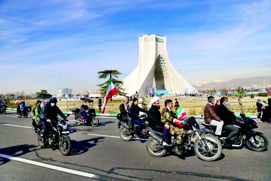 Iranians ride on motorcycles as they participate in the celebration of the 42nd anniversary of the Islamic Revolution in Tehran, Iran.