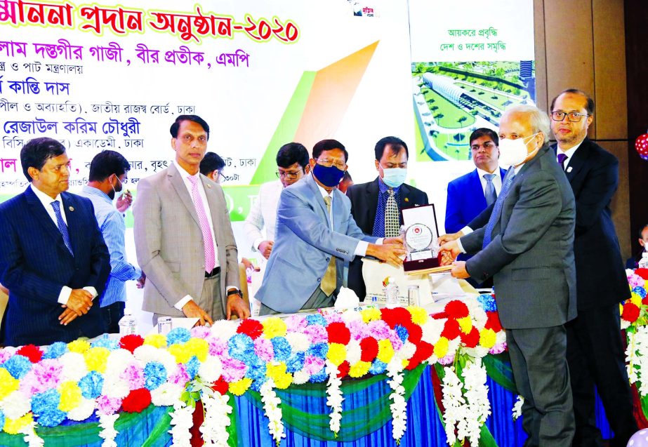 Professor Md. Nazmul Hassan, Chairman and Mohammed Monirul Moula, Managing Director and CEO of Islami Bank Bangladesh Limited (IBBL) receiving Tax Card for being the 2nd highest taxpayer in banking sector in 2019-2020 tax year Textile and Jute Minister Go