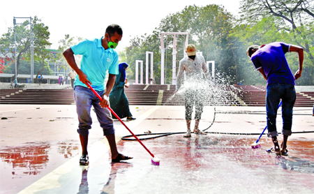 Workers clean up the Shaheed Minar premises on Friday ahead of International Mother Language Day to be observed on February 21.