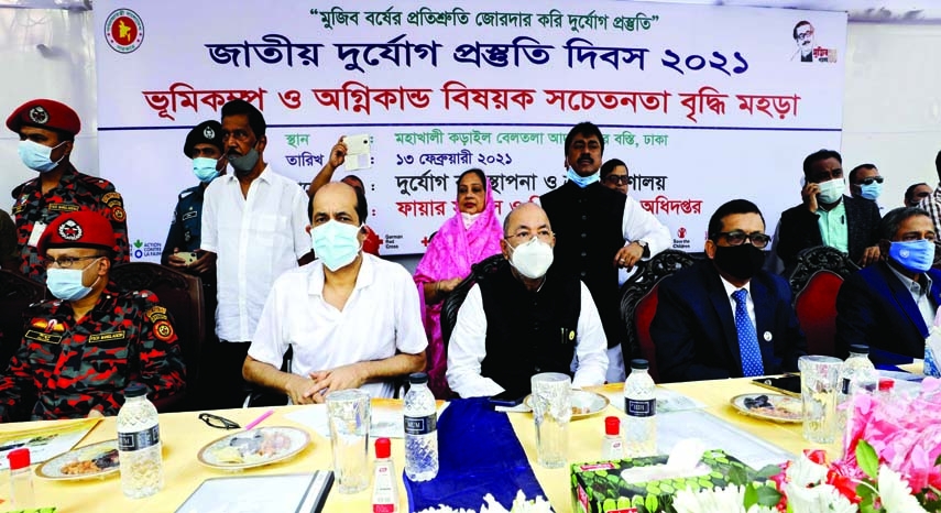 State Minister for Disaster Management and Relief Dr.Enamur Rahman, among others, at the drill programme on earthquake and fire at Karail Beltala Adarsha Nagar Slum in the city on Saturday.