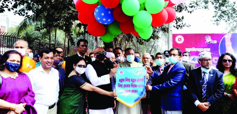 Information Minister Dr. Hasan Mahmud inaugurates the programme organised on the occasion of 'World Radio Day-2021' releasing balloons at Jatiya Betar Bhaban in the city on Saturday.