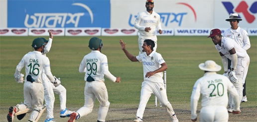 Bangladesh's cricketers celebrate after the dismissal of West Indies' John Campbell (not pictured) during the third day of the second Test between Bangladesh and West Indies at the Sher-e-Bangla National Cricket Stadium in the city's Mirpur on Saturday
