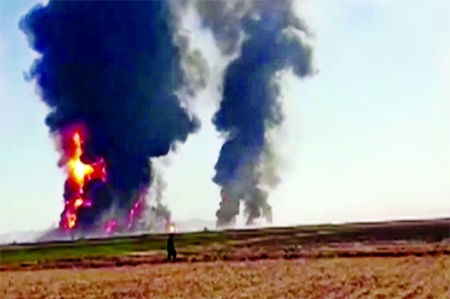 Fire and smoke rise from an explosion of gas tankers in Herat, Afghanistan, Feb. 13, 2021, in this picture obtained by Reuters from a video.