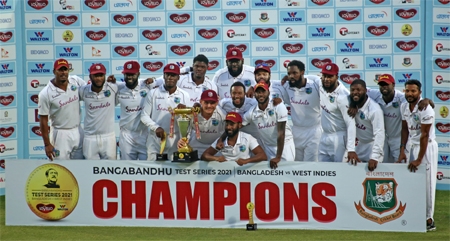 West Indies' players celebrate making a clean sweep of the two Test series against Bangladesh at the Sher-e-Bangla National Cricket Stadium in the city's Mirpur on Sunday.