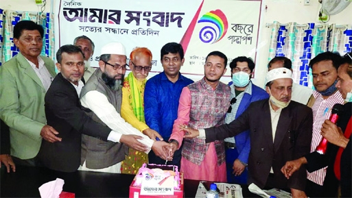 Distinguished guests celebrate the 8th founding anniversary of Amar Sangbad in the Dr Sazzad Auditorium in Feni town on Sunday afternoon by cutting a cake.