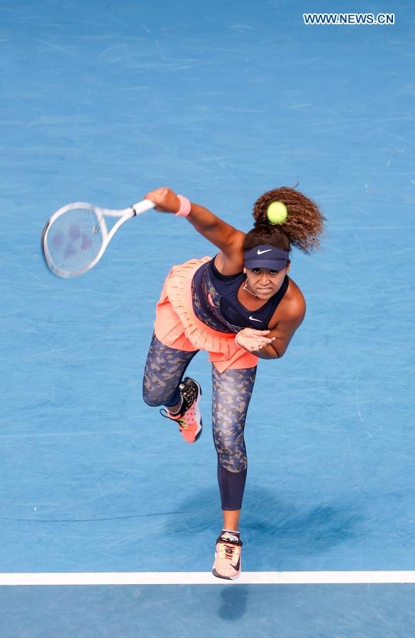 Naomi Osaka of Japan serves during the women's singles quarterfinal match against Hsieh Su-Wei of Chinese Taipei at Australian Open in Melbourne Park in Melbourne, Australia on Tuesday.