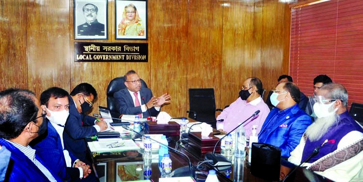 LGRD and Cooperatives Minister Tajul Islam exchanges views with the representatives of REHAB and BLDA about the implementation of DAP in the conference room of Local Government Division on Wednesday.