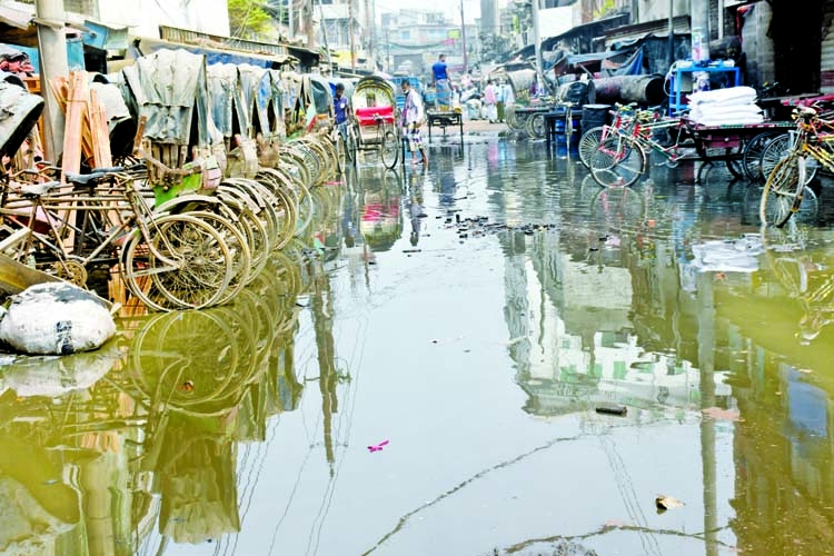 A road in the capital's Jurain area is being flooded with sewer water due to lack of a proper drainage system. This photo was taken on Wednesday.