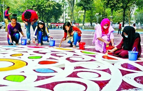 Students of Fine Arts of Dhaka University depict Alpona at the Central Shaheed Minar marking Amor Ekushey February and International Mother Language Day on Friday.