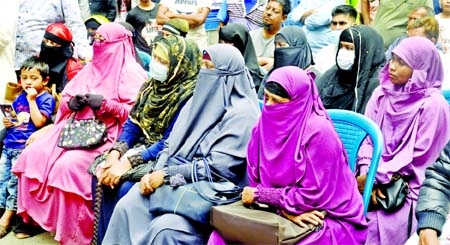 Relatives with tearful eyes sit attend mourning rally at Chawkbazar in the capital on Saturday marking the second year of Churihatta tragedy.