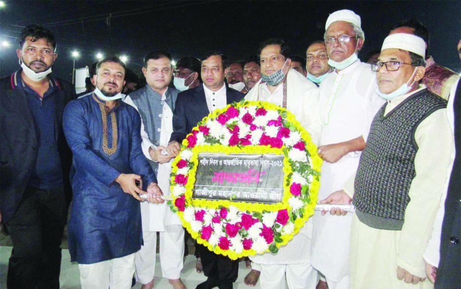 State Minister for Youth and Sports Zahid Ahsan Russell along with Gazipur City Corporation Mayor Jahangir Alam pay tributes to the martyrs of the historic language movement by placing wreaths at the Central Shaheed Minar in Gazipur on Sunday.