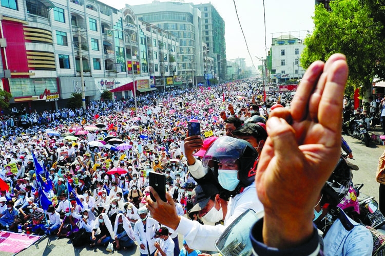 Demonstrators protest against a military coup in Mandalay, Myanmar on Monday.