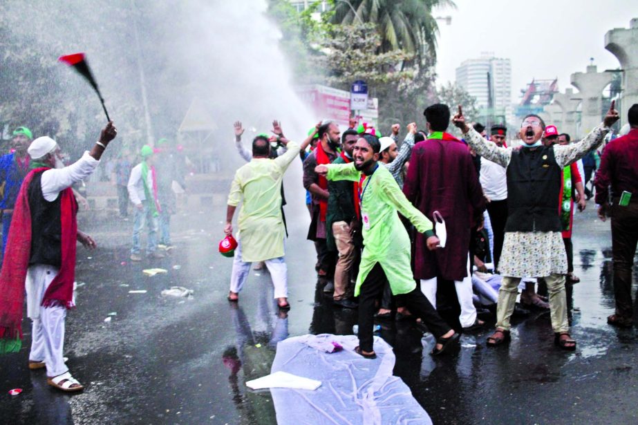 Police use water cannon to disperse freedom fighters' descendants who gathered in Shahbagh intersection, Dhaka on Tuesday to press home their seven-point demand, including the revival of 30 percent quota in government jobs.