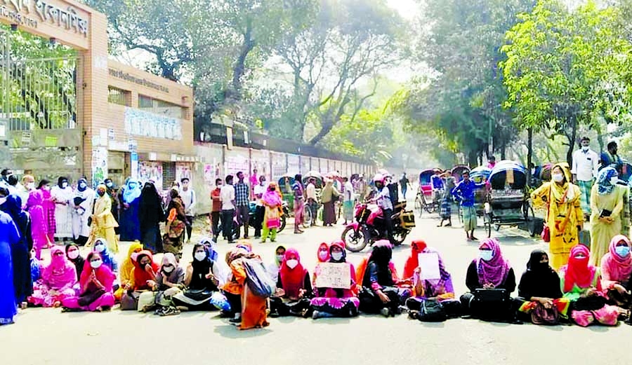 Students of Home Economics College stage demo in front of their college on Thursday demanding continuation of ongoing exams.