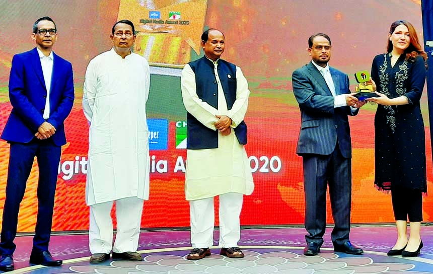 Sabiha Jarin Orona, Director of electronics manufacturing company Walton receiving the 'Digital Media Award 2020' from Jatiya Party Chairman and Deputy Leader of the Opposition in the Parliament GM Quader at a function held at Channel-I office in the ci